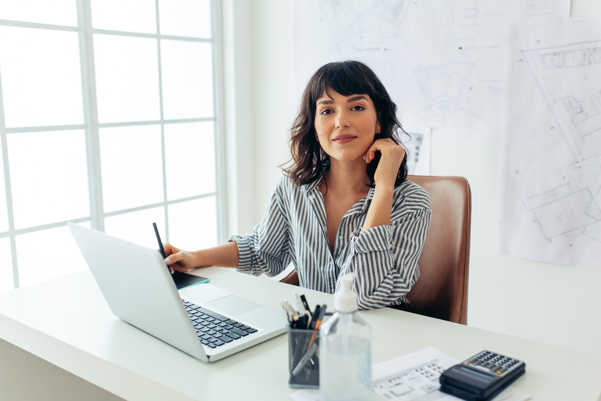 Portrait of confident female architect in office